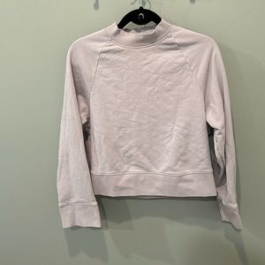 on cloud crew neck in light purple with zipper details on sides
